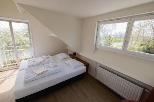Postel nebo postele na pokoji v ubytování Mer du Nord Breskens
