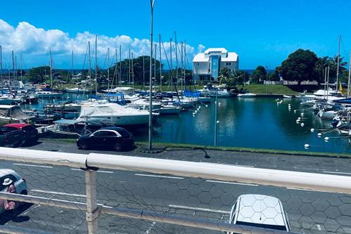 a marina filled with lots of boats in the water at Marin’Appart * vue sur mer* in Gourbeyre