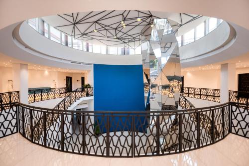 a view of the lobby of a building with a blue pillar at Orion City Hotel in Colombo