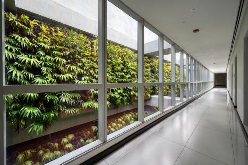 an office building with a vertical garden on the wall at Orion City Hotel in Colombo