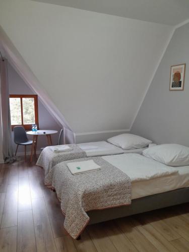 Een bed of bedden in een kamer bij Willa Góralka