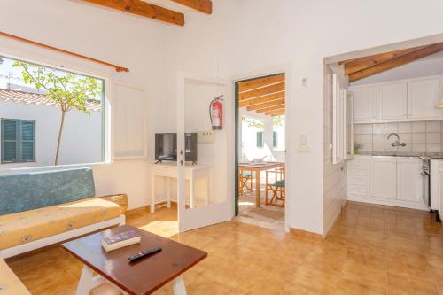 a living room with a couch and a table at Son Xoriguer 5 in Son Xoriguer