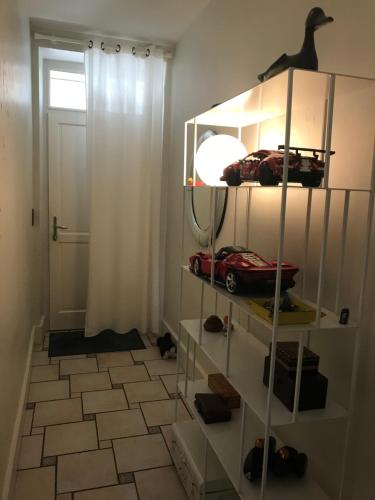 a room with a shelf with a toy car on it at Chambre d'hôtes Le Cadran des Chauvelles in Nevers