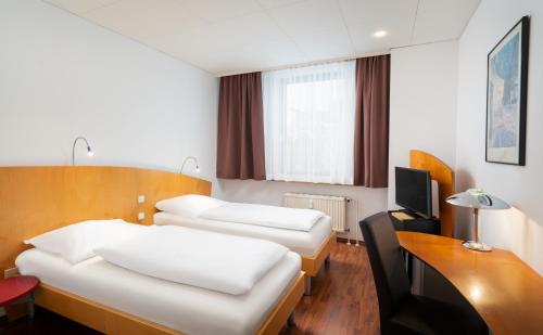 Televisyen dan/atau pusat hiburan di Mainstreet Hotel