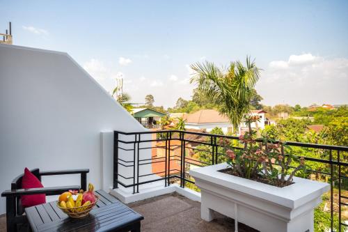 a balcony with a bowl of fruit on a table at Sala Siem Reap Hotel in Siem Reap