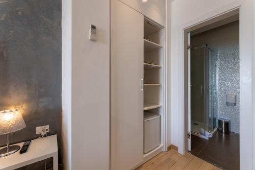 a room with a closet with a glass door at B&B Skyfall in Split
