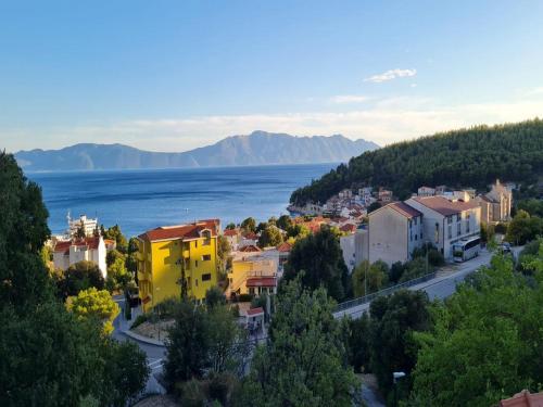 a city with a view of the water and buildings at Holiday Home Mico in Drvenik