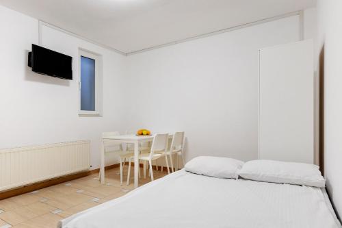 Ένα ή περισσότερα κρεβάτια σε δωμάτιο στο DD Boutique Apartments
