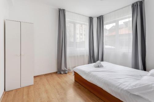 Ένα ή περισσότερα κρεβάτια σε δωμάτιο στο DD Boutique Apartments