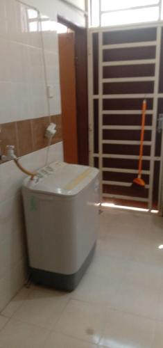 a bathroom with a toilet in the corner of a room at Homestay Humair in Marang