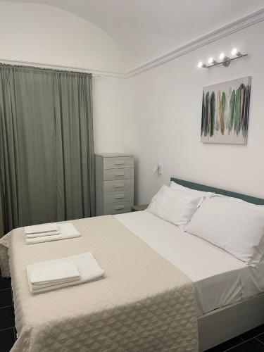 Letto o letti in una camera di GIKLA MAISON
