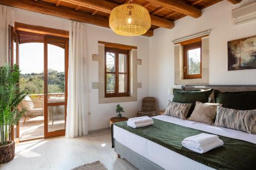 Ένα ή περισσότερα κρεβάτια σε δωμάτιο στο Villa Mesogea