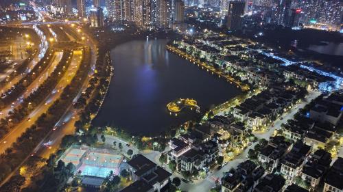 an aerial view of a city at night at Studio Lake view Vinhomes Greenbay #Jerry's House in Hanoi