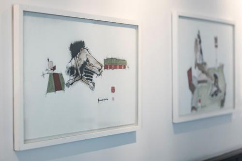 two framed pictures on a wall in a room at Kunsthotel "Drei König" am Marktplatz Stadt Lörrach in Lörrach