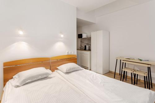 Ένα ή περισσότερα κρεβάτια σε δωμάτιο στο DD Boutique Apartments