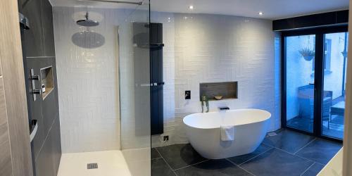 a bathroom with a white sink and a glass shower at Beech Hill Hotel & Spa in Windermere