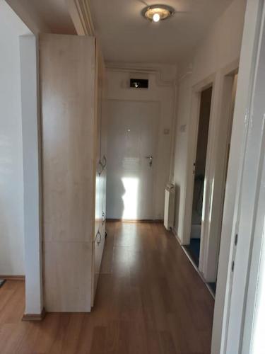 an empty hallway of an apartment with a hard wood floor at Cvijićeva in Belgrade