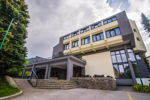 a large white building with a lot of windows at Hotel Prebold in Prebold