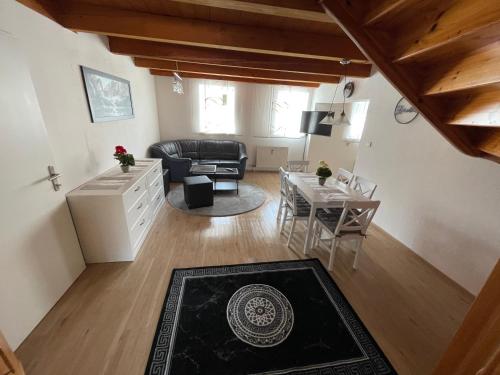 a living room with a couch and a table at TM Apartment in Eibiswald