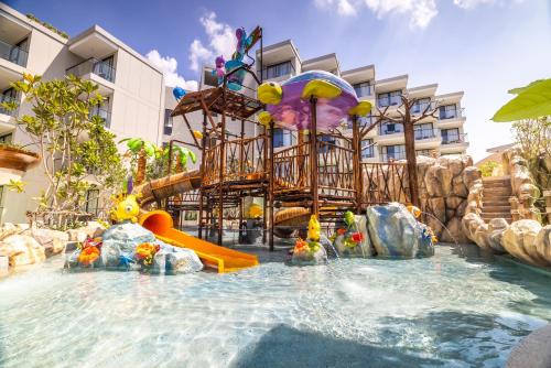 a water slide at a resort with a water park at Phuket Emerald Beach Resort in Karon Beach