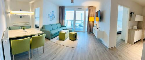 a living room with a couch and a table at SECRA Exclusive Fewo Frida BOW 321 in Kappeln