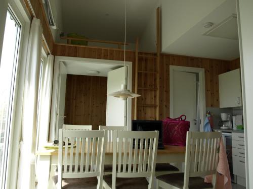 a dining room with a table and chairs at Camp Hverringe in Dalby