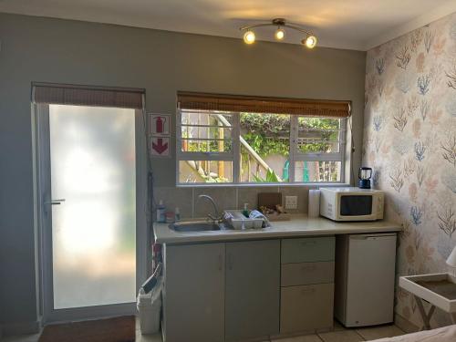 Una cocina o zona de cocina en Cozy Corner Units