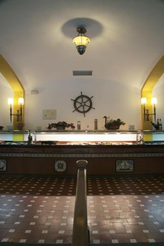 a large room with a light on the wall at Hotel La Carolina in Lloret de Mar