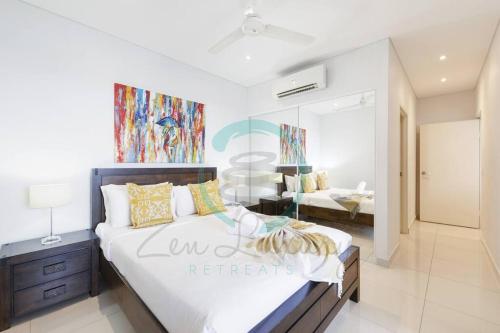 a bedroom with a large bed in a room at ZEN Central Bliss 2BR Holiday Retreat in the CBD in Darwin