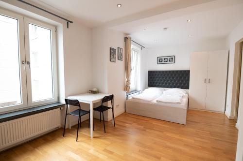 Ένα ή περισσότερα κρεβάτια σε δωμάτιο στο Charming Apartments Frankfurt City