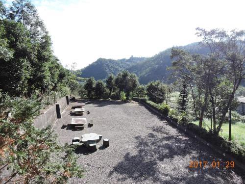 a group of benches sitting in a parking lot at Song Lin Homestay in Dongshan