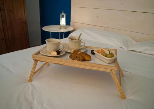 Ένα ή περισσότερα κρεβάτια σε δωμάτιο στο Porto Trani