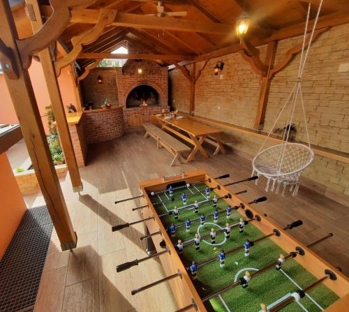 an overhead view of a toy soccer game in a room at Holiday&wellness house Grofica in Daruvar