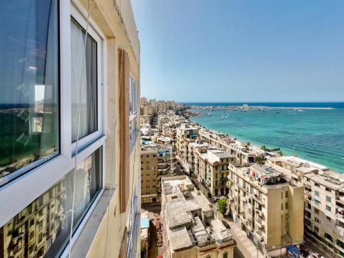 a view of the ocean from a building at Downtown Sea View Suites in Alexandria