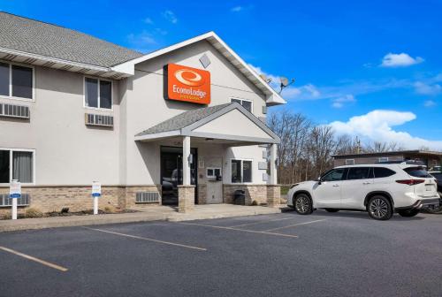 a car parked in a parking lot in front of a hotel at Econo Lodge Inn & Suites Canandaigua - Finger Lakes Area in Canandaigua