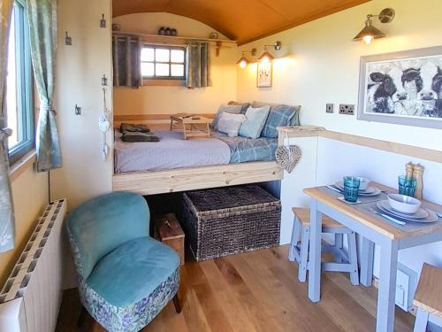 a bedroom with a bed and a desk and a table at Fell Foot - Ukc5294 in Bassenthwaite