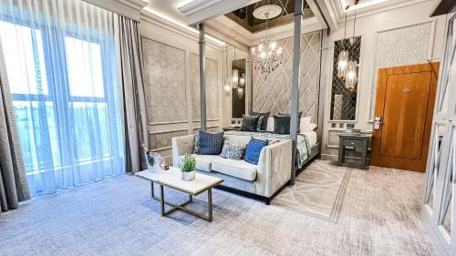 a living room with a couch and a bed at Errigal Country House Hotel in Cootehill