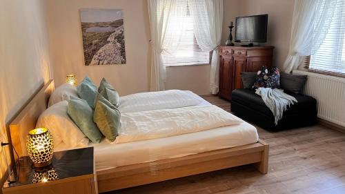 a bedroom with a bed and a chair at Perau in Gmünd in Gmünd in Kärnten