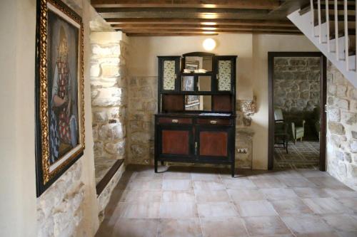 a hallway with a book shelf in a house at Casa de San Lorenzo in Úbeda
