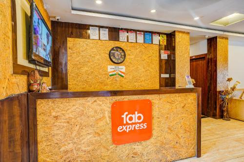 a hotel lobby with aida express sign on the wall at FabExpress Gauri Shree in Bhopal
