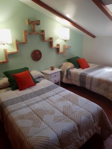 Posteľ alebo postele v izbe v ubytovaní La Buhardilla