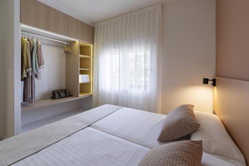 Katil atau katil-katil dalam bilik di BALI Premium Apartments 1 bedroom