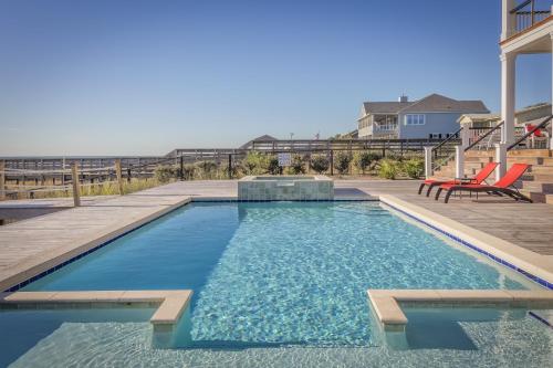 a swimming pool with a table and chairs on a patio at Bold Lab Studio 