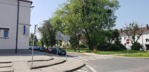 a street with cars parked on the side of the road at Apartament Dubaj in Gliwice