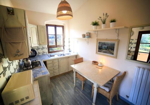 a kitchen with a table with a candle on it at Podere Bellavista in San Gimignano