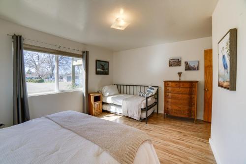 a bedroom with a bed and a window at Waterfront Lakeport Rental Home with Private Dock! in Lakeport