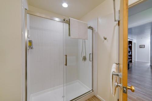 a shower with a glass door in a bathroom at Waterfront Lakeport Rental Home with Private Dock! in Lakeport