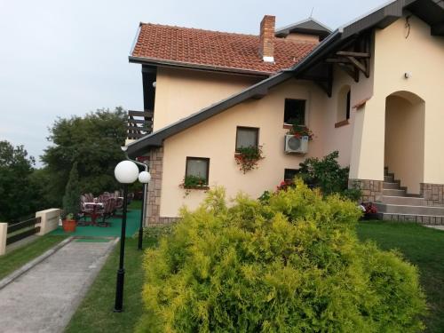 a house with a street light in front of it at B&B Vila Vidikovac in Arandjelovac
