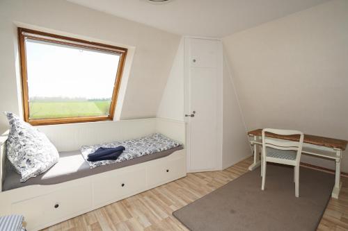 Ένα ή περισσότερα κρεβάτια σε δωμάτιο στο Ferienhaus Kiebitz mit Sauna