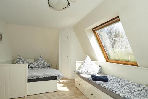 Postel nebo postele na pokoji v ubytování Ferienhaus Kiebitz mit Sauna